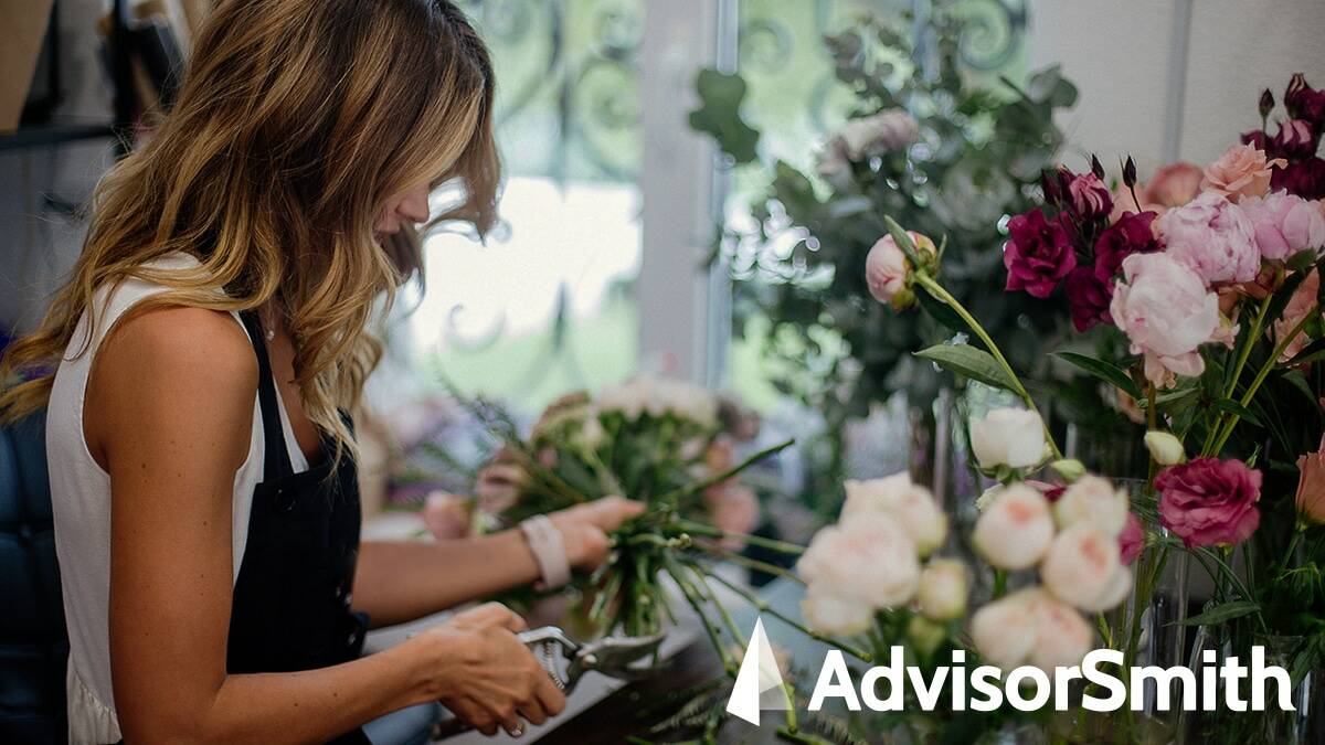 Woman cutting flowers in small business for progressive commercial insurance review